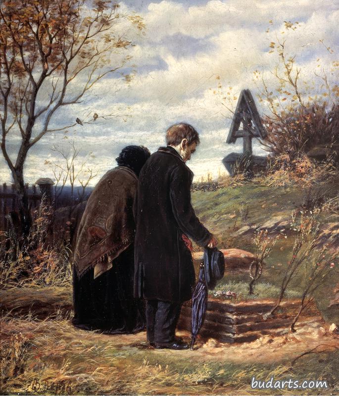 一对年迈的夫妇在儿子的墓前
