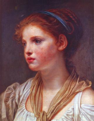 Portrait of a young girl with a blue ribbon
