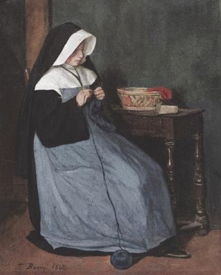 坐在桌前编织的修女
