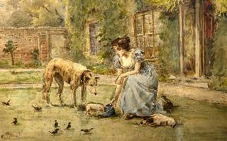 Young girl feeding the dogs