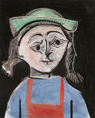 Little girl with pigtails and green hat
