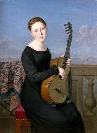 Young woman in the black dress, playing the guitar