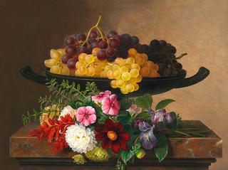 Flowers and grapes on a stone sill
