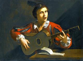 A Guitar Player seated in an interior