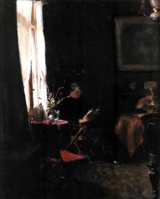 Interior with young girl reading at the window