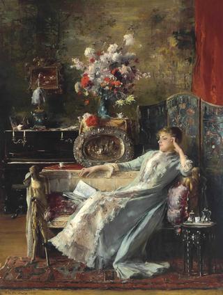 Young Woman Sitting on a Sofa