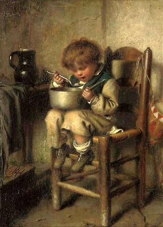 A boy eating porridge