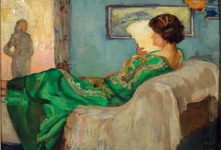 Woman in a green dress on the sofa