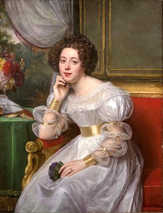 Portrait de madame Demetz dans un canapé rouge