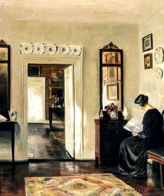Interior with a painter's wife reading