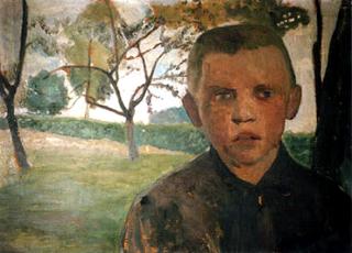 Boy in front of an apple tree