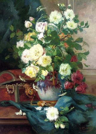 Red roses, white roses and horse parsley in an ornamental vase by a chest of jewels on draped ledge