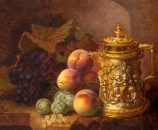Black grapes, peaches, greengages and whitecurrants beside an ornamental gilded tankard