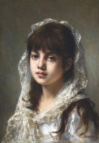 Portrait of a young girl wearing a white veil