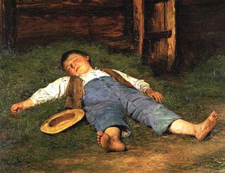 睡在干草里的男孩
