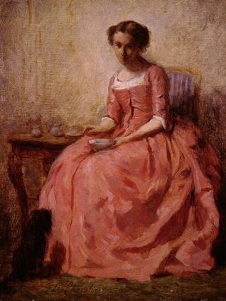 Girl in a Pink Dress Sitting at a Table with a Dog