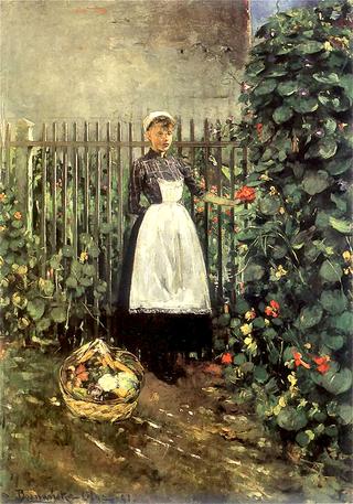 在花园里拿着一篮子蔬菜的女孩