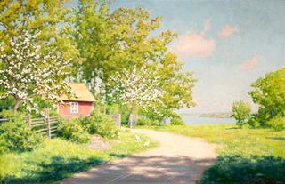 Cottage with blooming fruit trees