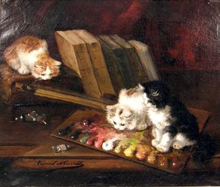 three kittens in an artist's studio