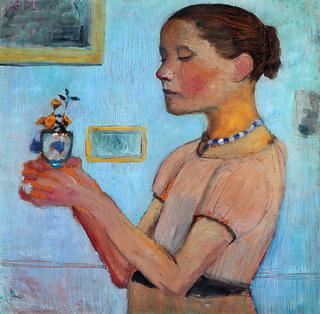 Young girl with yellow flowers in the glass