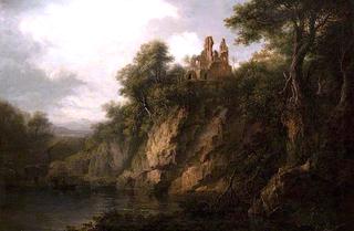湖边有一座被毁坏的城堡的多岩石的森林景观