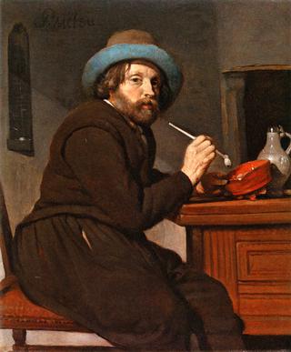 A Man Holding a Pipe
