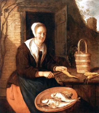 A Woman Cleaning Carrots