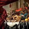 Pronk Still Life with Silver and Gilt Vessels, a Nautilus Shell, Porcelain, Food and Other Items on a Draped Table