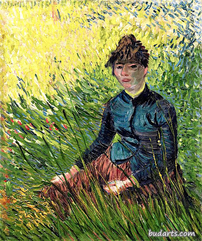 坐在草地上的女人