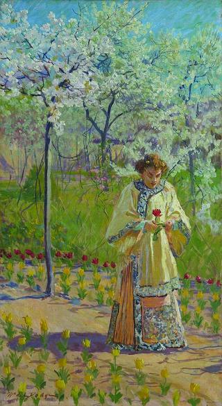 Lady walking in a Garden