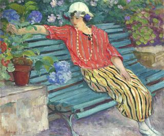 Young woman seated with hydrangeas