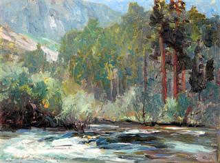 Rushing River at the Base of a Mountain