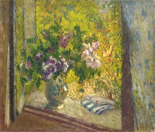 Vase of flowers in a window