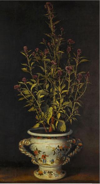 A plant, probably a Gomphrena, in a nevers-style faience jardiniere