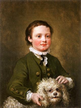 A Boy Holding a White Poodle