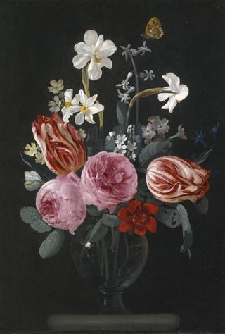 A still life of tulips, roses, daffodils and other flowers on a ston