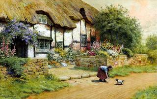Befriending a puppy outside a cottage garden