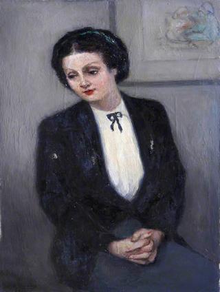 Seated Lady Wearing a Black Jacket