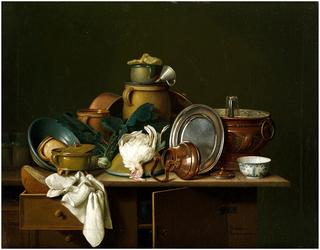 A kitchen still life with dishes, fruit and poultry