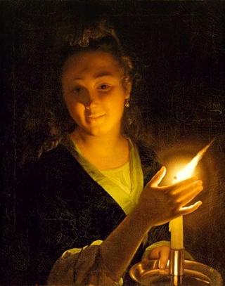 Young woman with candle