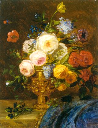 A still life with flowers in a golden vase