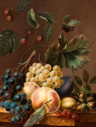 Still life of fruit and nuts on a plinth