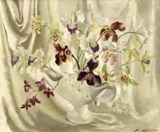 Orchids in a white vase