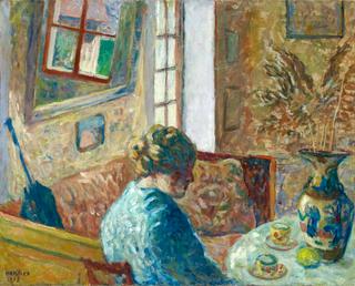Interior with a Young Woman at a Table