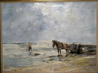 A fisher at the sea surf
