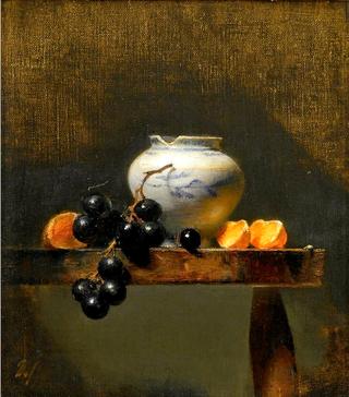 White vase and oranges