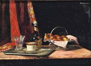 Bread in a silver basket, a wine bottle and a glass and tea cup on a silver tray, on a table