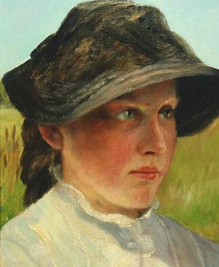 Portrait of a young woman wearing a hat