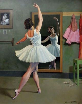 Ballerina Posing in front of a Mirror