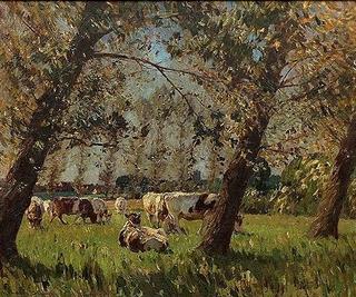 Cattle grazing in wooded landscape with distant village and church